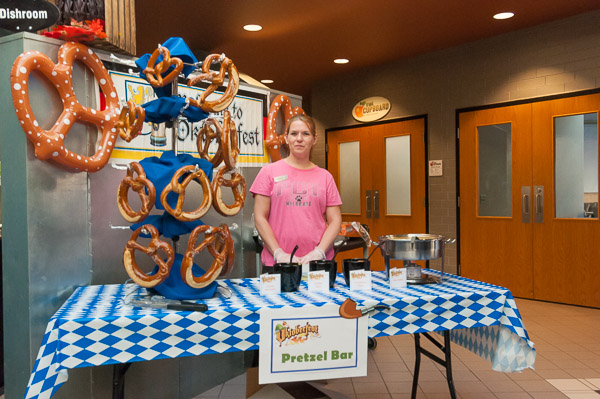 A jumbo soft-pretzel bar is in the capable hands of Crystal E. Way, a campus catering assistant.