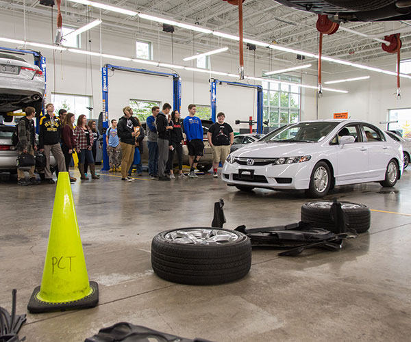 In the Parkes Automotive Technology Center, Christopher H. Van Stavoren, assistant professor of automotive technology, demonstrates the importance of anti-lock braking systems.