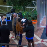 Retiring as the college's vice president for information technology after nearly 40 years at the college, alumnus Mike Cunningham (in tie at center) talks with Anthony J. Pace, student activities director.