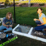 Kahn (left), who envisioned the mosaic, works with Goldsmith to breathe life into the design ...