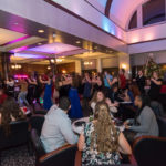 Tables allow comfortable dining and conversation in view of the dance floor ...