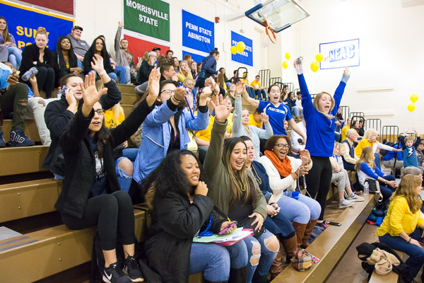 A cheering section boisterously honors its assignment!