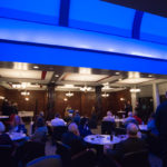 Under a Wildcat Blue glow in the Community Arts Center’s Capitol Lounge, donors gather prior to the Hollywood special effects show, Hollywood SFX.