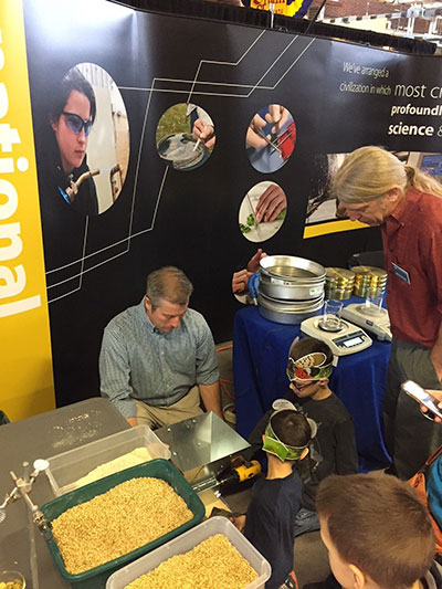 ... and represents the School of Sciences, Humanities & Visual Communications with D. Robert Cooley, associate professor of anthropology/environmental science.