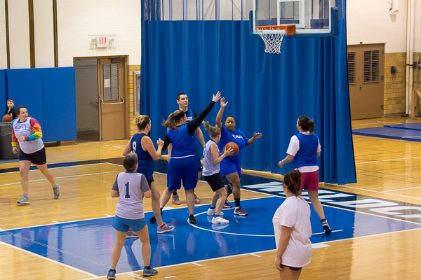 Alumni mix it up on their former home court.