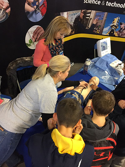 Nursing education's Samatha M. Weaver (background), learning laboratory coordinator, and Jessica L. Bower, simulation laboratory coordinator, employ
