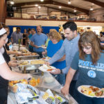 Employees enjoy a catered lunch