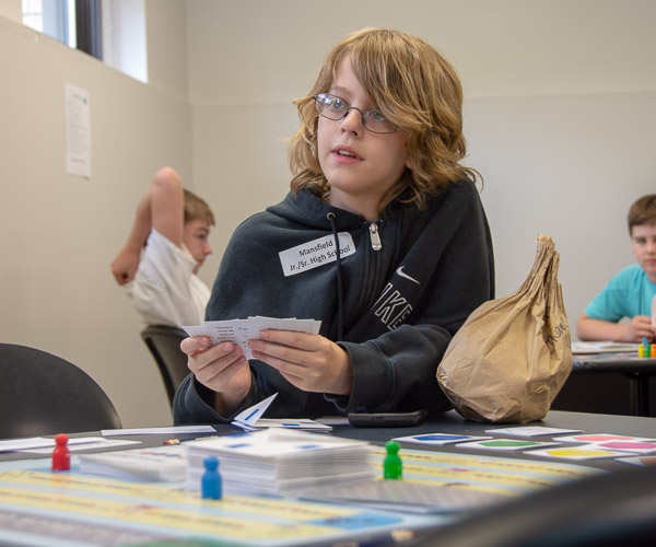 Students from North Penn-Mansfield Jr./Sr. High School play an interactive board game developed by the Academic Success Center. The guests assumed the role of new students, making decisions to get through their first semester successfully.