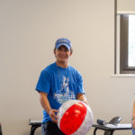 Already appropriately dressed in Wildcat wear, a new student answers a question posed on a beach ball that was circulated as a conversation-starter.