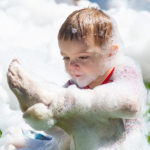 Sitting in the grass, rub-a-dub-dubbing