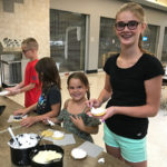 Smiles abound during camp activities.