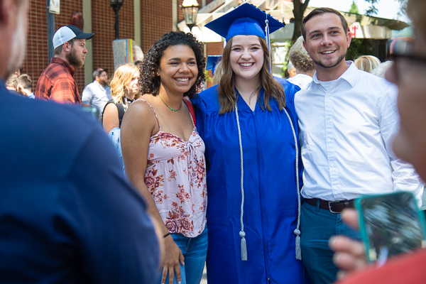 Christie L. Barnes poses for photos with friends. The New Ringold resident received a radiography degree.