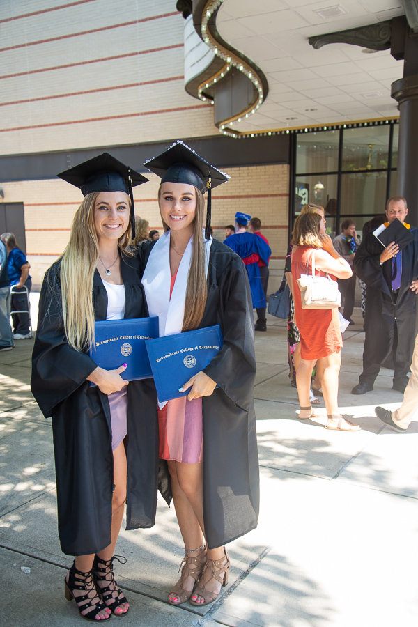 The marquee lights can't outshine the smiles of physician assistant graduates Kurstyn T. Pfleegor, of Northumberland, and Montanah R. James, of Danville.