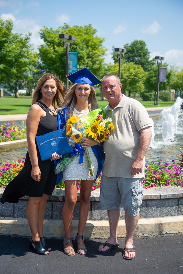 The entrance fountain and florals offer a gorgeous setting for photos of Kierstin R. Goodby and her parents. Goodby, of Jersey Shore, graduated in health arts: practical nursing emphasis.