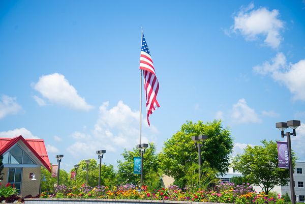 After a week of stormy weather, summer graduates and their guests were greeted with blue skies and bountiful color.