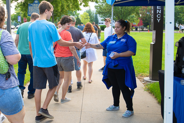 At a refreshment tent, Natascha G. Santaella, a Connections Link, greets families and distributes activities information. Santaella, ’18 baking and pastry arts, is an applied management student from Guaynabo, Puerto Rico.