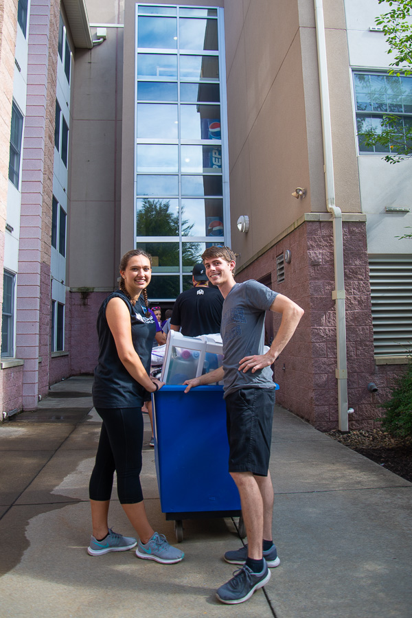 Waiting in line outside Lancaster Hall are helpers Kelsey L. McKenrick, of Gilbertsville, dental hygiene, and Justin L. Stanton, of Newfoundland, construction management. McKenrick is an RA.
