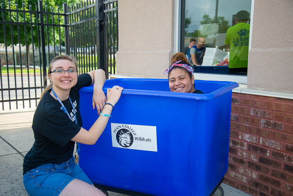 Enjoying a respite in the shade (and in the bin) are Resident Assistants Amber L. Way (left) and Rossell Burgos. Way is an occupational therapy assistant student from Port Matilda. Burgos, of Hazleton, majors in architectural technology.