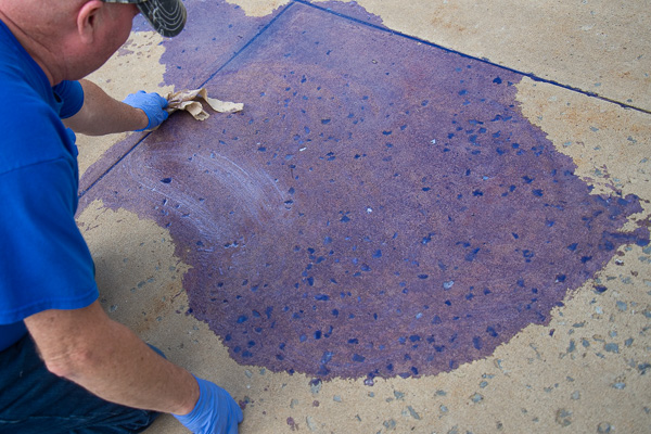 Clean-up in aisle two (on the way to Delaware Hall)! Lynn E. Doane, a residence halls custodian, handles a casualty of the day: the remnants of a fallen laundry detergent jug (in a lovely shade of Wildcat Blue).
