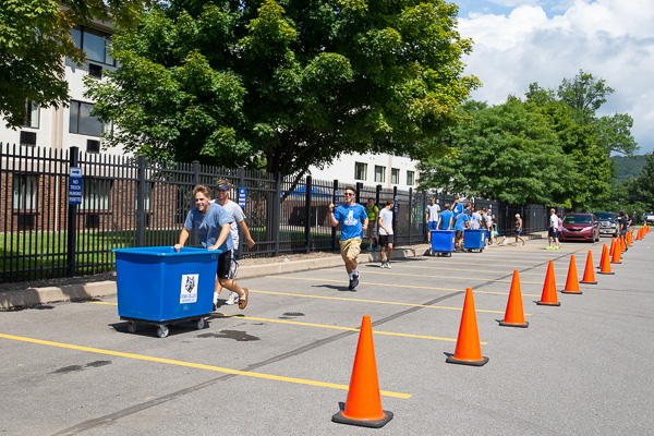 Enthusiastically running and rolling to help the next move-in “client”
