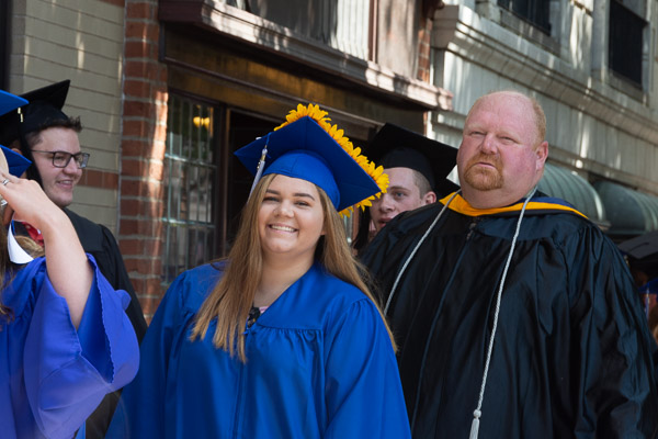David R. Cotner, dean of the School of Industrial, Computing & Engineering Technologies, joins students on the walk to the theater.
