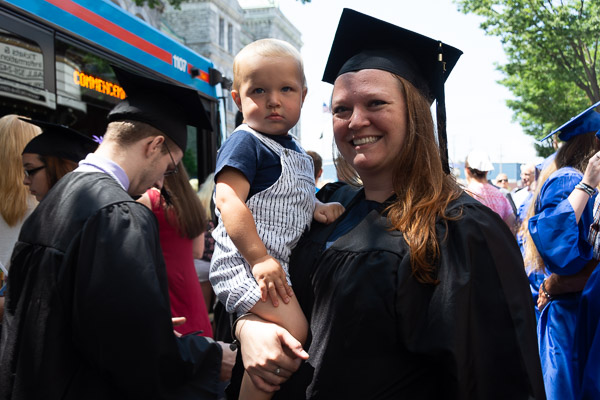 Physician assistant graduate Abbey L. Bower celebrates with her son.