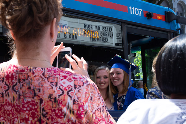 The CAC's facade is reflected in a bus window as happiness comes into focus.