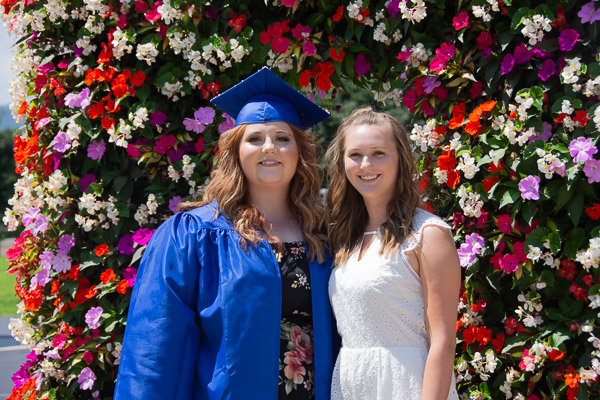 A well-wisher joins a Penn College tomorrow-maker in full bloom.