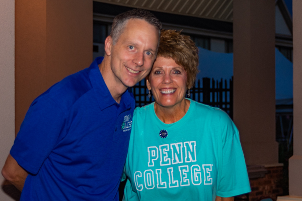 Collegial co-workers on hand to greet students: Michael J Reed, dean of sciences, humanities and visual communications, and Kay E. Dunkleberger, director of disability services.