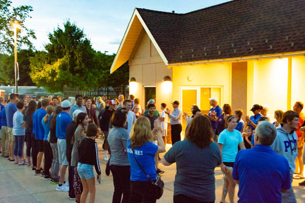 Employees and their families line the Rose Street Commons sidewalk to applaud incoming first-year students and transfers – more than 1,500 strong – entering the courtyard for an official Penn College welcome.