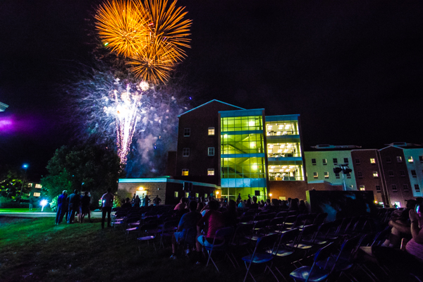 Fireworks burst onto the scene, cued to the close of remarks ...