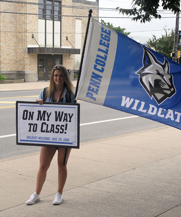En route to her first class, pre-dental hygiene student Morgan Elizabeth Smith, of Quakertown, pauses to mark the banner day.