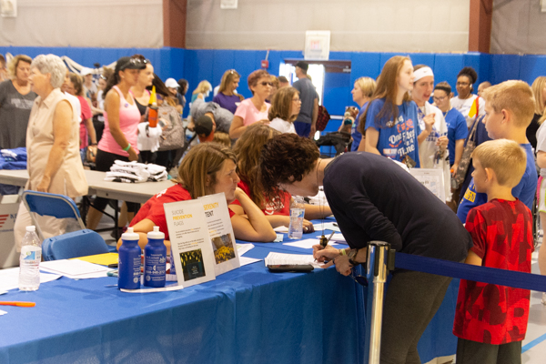 The walk is preceded by registration in the Field House, where teams gather and walkers turn in their pledges.