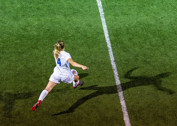 Shadows follow the Wildcats' Francesca Timpone under the lights at the Balls Mills soccer complex, where Wednesday's game was moved due to soggy field conditions on main campus.