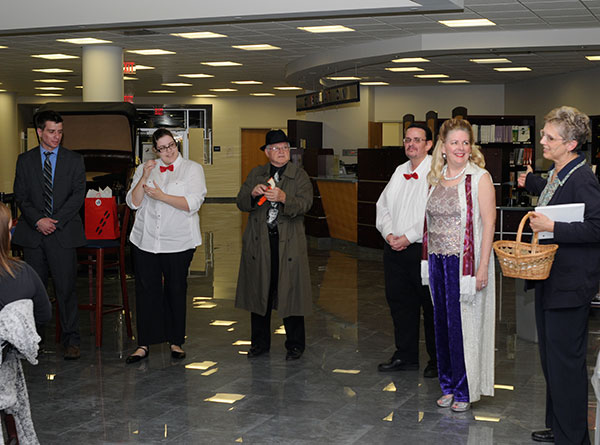 Rogers (right) introduces her cast during the curtain call. From left are Tim Hippensteel, Kayleigh Woods, Rhinehart, Lowmiller and Pfeil.