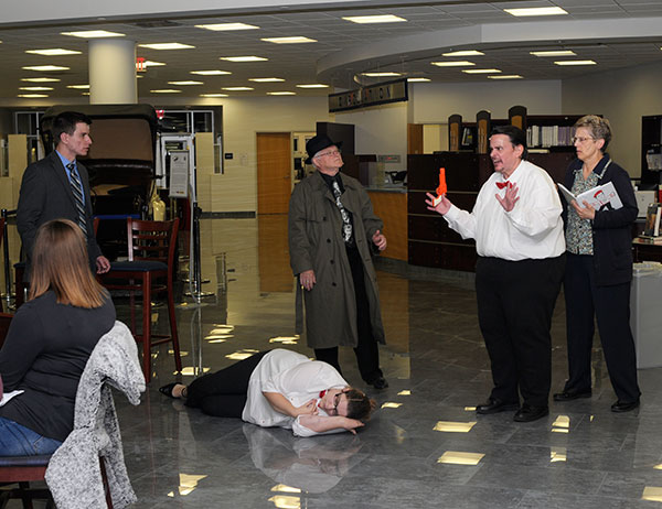 ... in which bumbling waiter Milton Floog (Fred Lowmiller Jr.) is caught red-handed.