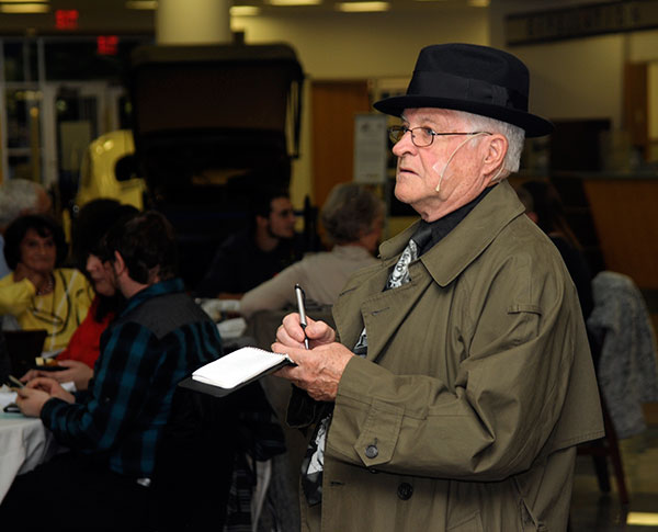 A vigilant Det. Joe Carmen (Larry Rhinehart) solicits dinner guests' observations to supplement his investigation.