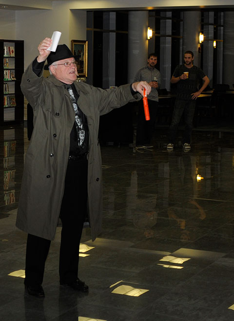 The gumshoe displays the murder weapon and a purported forensics report designed to smoke out the guilty party.