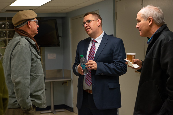 The guest of honor extends his already-full day in ongoing chat.