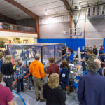 The theater of battle fills with participants and spectators.