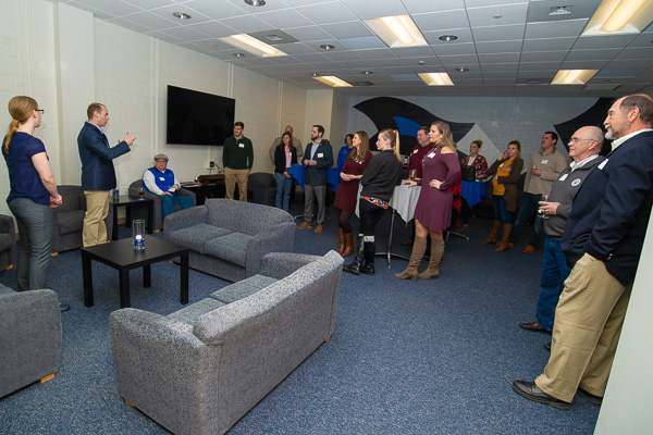 Women’s and men’s head coaches Lauren Healy and Geoff B. Hensley (at left) share their enthusiasm with the Wildcat basketball family.