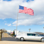 Under beautiful blue skies (and a blustery wind that lifted the American flag to fittingly full display), "Tony" passes beneath the landmark he marshaled and maintained.
