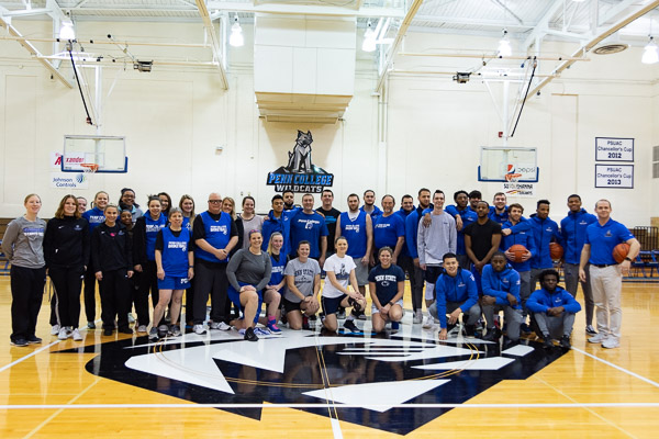 Alumni hoopsters join current Wildcat athletes and coaches in a midcourt mingle.