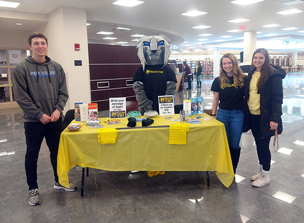 Helping the 'cat enlighten Madigan Library patrons are (from left) Tanner J. Layne, an information assurance and cyber security student from Chesapeake, Va.; Tasia A. Werkmeister, of Altoona, majoring in health arts: practical nursing emphasis; and Madison T. McClelland, pre-nursing, of Columbia Cross Roads.