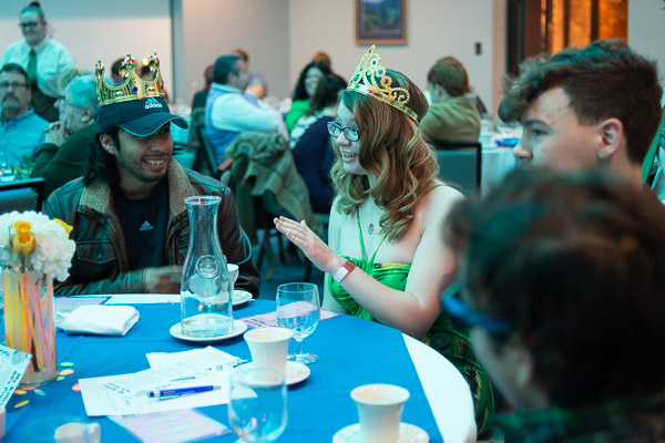 Cassandra D. Henderson, of Hazel Hurst, shares a captivating suspicion with her table (including alumnus Christopher J. Morrin, left, who holds a bachelor's and two associate degrees from Penn College).
