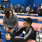 Kathleen V. McNaul, director of college transitions and first year initiatives, talks with Frankie M. Gagliardi III, of Pottstown.