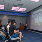 Modern manufacturing is extolled in a video shown by Michele Edwards (at podium), human resources manager at First Quality Enterprises.