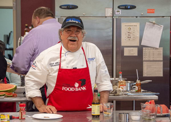 Chef Michael J. Ditchfield, instructor of hospitality management/culinary arts, describes his dishes for the audience in the Central Pennsylvania Food Bank’s community learning kitchen.