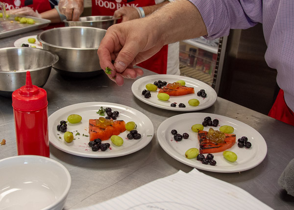 Pellegrino adds mint to the blue team’s grilled watermelon dessert.