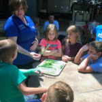 Bloom answers questions in an herbal roundtable. (Seated in the background is Jeremy R. Bottorf, coordinator of athletics for club sports, intramurals.)